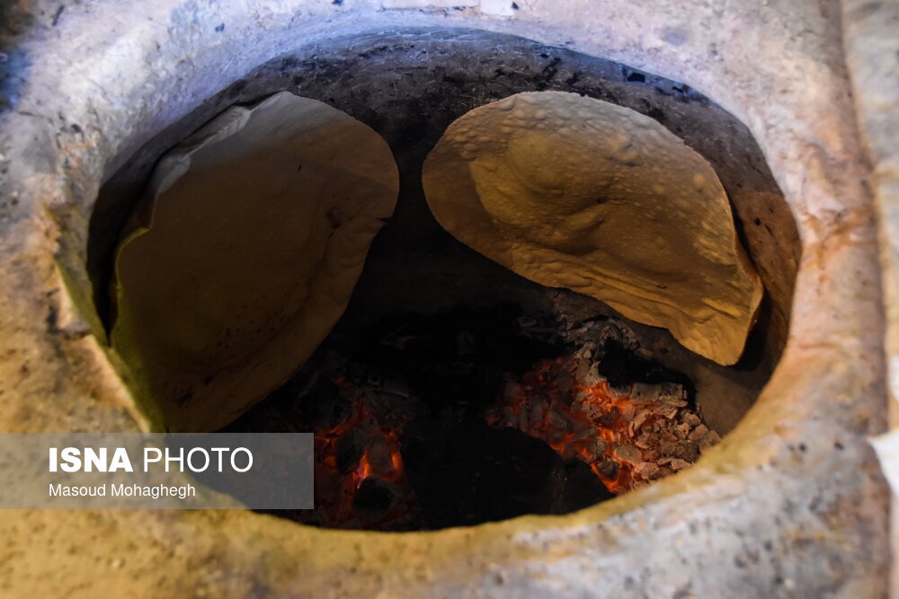 تصاویر: آیین سنتی پخت نان نذری در روستای لاسجرد سرخه - سمنان